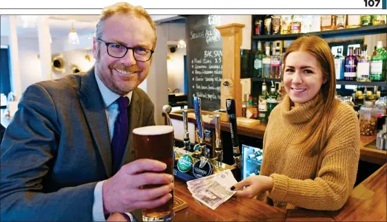  ??  ?? WE’LL DRINK TO THAT: Toby Walne enjoys a pint at the Brewery Tap where landlady Lucy Bonner says the cashback scheme will ‘be embraced with open arms’