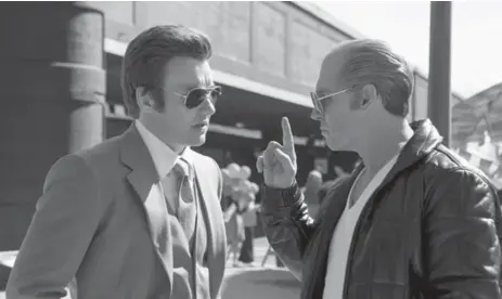  ??  ?? Joel Edgerton, left, and Johnny Depp star in Black Mass, which screened at TIFF and now is opening in wide release.