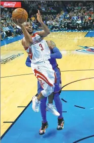  ?? SUE OGROCKI / AP ?? Houston Rockets guard Chris Paul shoots in front of Oklahoma City Thunder defender Carmelo Anthony during the second half of Tuesday’s NBA game in Oklahoma City. The Rockets posted their 16th straight victory, 122-112.