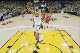  ?? Marcio Jose Sanchez The Associated Press ?? Golden State Warriors guard Stephen Curry skies for a layup against the Houston Rockets in Game 6 of the Western Conference Finals on Saturday in Oakland, Calif. The Warriors forced a deciding Game 7 with a 115-86 victory.