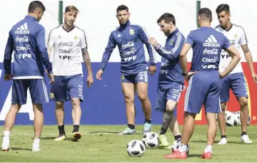  ??  ?? Lionel Messi (third right) passes the ball to teammates during training session at the team’s base camp in Bronnitsy, near Moscow, Russia on the eve of the World Cup Group D football match against Croatia to be held in Nizhni Novgorod. — AFP photo