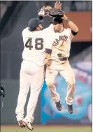  ?? RAY CHAVEZ — STAFF FILE PHOTO ?? The Giants’ Pablo Sandoval (48) and Gregor Blanco celebrate a victory in 2012, when they started for a World Series champion.