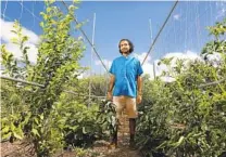  ?? CHRISTINA HOUSE LOS ANGELES TIMES ?? Rishi Kumar at his farm in Pomona. “I would love for people to go and see the gardens as they are changing,” he said. “They are not visiting a place; they are visiting a being.”