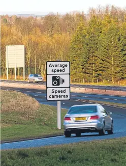  ?? Picture: Steve MacDougall. ?? A sign near Auchterard­er warns motorists that average speed cameras are in operation on the A9.