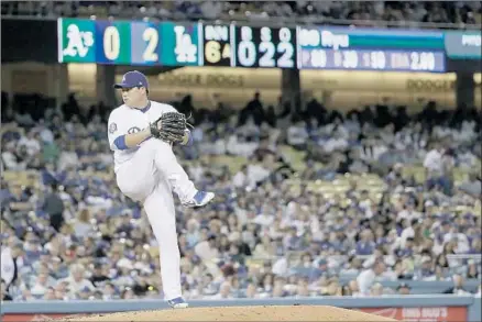  ?? Robert Gauthier Los Angeles Times ?? HYUN-JIN RYU of the Dodgers delivers on the way to a one-hit, eight-strikeout effort in six innings against the Oakland Athletics.