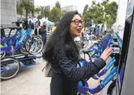  ??  ?? Lyft, which operates the Ford GoBike program, offers rental bikes that are parked in docks when not in use.