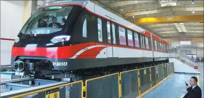  ?? XU XING / FOR CHINA DAILY ?? A maglev train waits to leave its station in Changsha, capital of Hunan province.