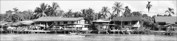  ??  ?? The serene scene of Kampung Seberang Kedai across the Limbang Waterfront.