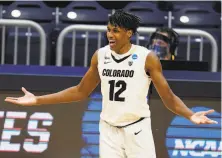 ?? Michael Conroy / Associated Press ?? Colorado forward Jabari Walker celebrates one of his five 3pointers against Georgetown. Walker had 24 points.