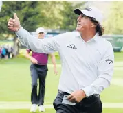  ??  ?? Phil Mickelson gives a thumbs up as he finishes his round on the 18th green during the first round of the Safeway Open.