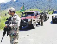  ?? ?? Security officials patrol near the town of Wabag, Papua New Guinea, Feb. 19, 2024.