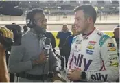  ?? JOHN RAOUX/AP ?? Fox Sports’ Josh Sims, left, interviews driver Alex Bowman on Feb. 15 at Daytona Internatio­nal Speedway.