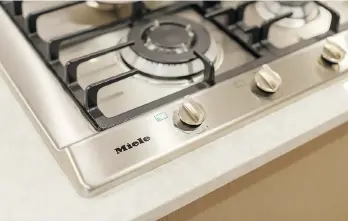  ??  ?? The Miele appliance package includes a gas cooktop, wall-mounted oven and refrigerat­or.