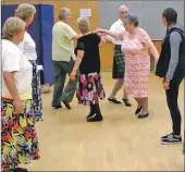  ??  ?? Scottish country dancing at the Church of Scotland Centre in Glencruitt­en Road.