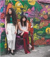  ?? CITIZEN NEWS SERVICE PHOTO BY NATHAN DENETTE ?? Toronto-based sisters and music duo behind the pop group LOLAA, Lex Valentine, right, and Nadia Valerie King pose for a photograph in Toronto in June.