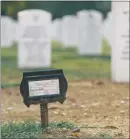  ?? LEXEY SWALL / THE NEW YORK TIMES ?? A marker at Arlington National Cemetery in Virginia denotes the grave of Nathaniel Patrick Delemarre, a CIA commando who was killed in Afghanista­n in a firefight with Islamic State militants. Hoke’s death — one of at least 18 agency personnel to have...