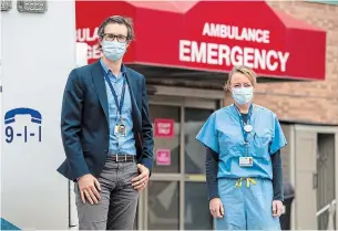  ?? FRANK GUNN THE CANADIAN PRESS ?? Dr. Jerome Leis, left, and Dr. Lynfa Stroud attended to “Patient Zero” — Canada’s first COVID-19 case — at Toronto’s Sunnybrook Health Sciences Centre on Jan. 23 last year. “We’d never seen a case like this before,” Dr. Leis said. “I’d never seen an X-ray quite like that one.”