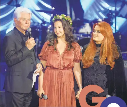  ?? MICKEY BERNAL/GETTY ?? Larry Strickland, from left, Ashley Judd and Wynonna Judd are seen at a May event honoring Naomi Judd.