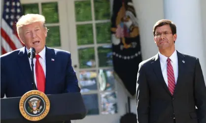  ?? Photograph: Saul Loeb/AFP/Getty Images ?? Trump with Esper in 2019. Trump boasted in the statement: ‘Mark Esper was weak and totally ineffectiv­e, and because of it, I had to run the military.’