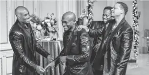  ?? MICHAEL GIBSON, UNIVERSAL PICTURES ?? Morris Chestnut, left, Taye Diggs, Harold Perrineau and Terrence Howard play college pals who get together for a long, long house party for Christmas.