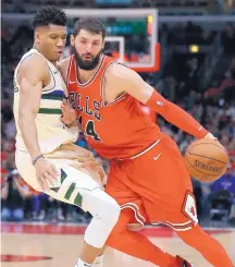  ?? NAM Y. HUH/ASSOCIATED PRESS ?? Chicago forward Nikola Mirotic, right, who had been seeking a trade all season, will be moving on to New Orleans after a big trade with the Pelicans.