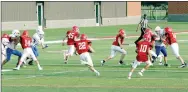  ?? MARK HUMPHREY ENTERPRISE-LEADER ?? Farmington freshman Will Hellard scored the first touchdown for the school at Cardinal Stadium by returning a kickoff 85 yards to the house against Rogers. The junior Cardinals were defeated in their home debut by a score of 28-14 on Aug. 26.