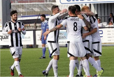  ?? Picture: Steve Lewis ?? Llandudno celebrate Lewis Buckley’s goal against Airbus last Saturday