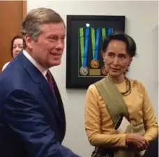  ?? DAVID RIDER/TORONTO STAR ?? Aung San Suu Kyi met privately with Mayor John Tory on Friday before greeting a city council chamber packed with Burmese-Canadians.