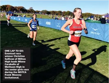  ?? JIM MICHAUD / BOSTON HERALD ?? ONE LAP TO GO: Eventual race winner Christina Sullivan of Milton High leads Miana Caraballo of Methuen High in the senior girls race during the MSTCA Frank Mooney Invitation­al.