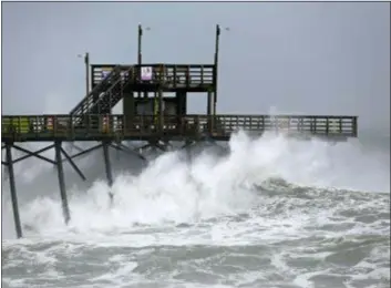  ?? TOM COPELAND — THE ASSOCIATED PRESS ?? Waves from Hurricane Florence pound the Bogue Inlet Pier in Emerald Isle N.C., Thursday.