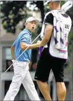  ?? MIKE BROWN THE COMMERCIAL APPEAL FILES ?? Ben Crane, who moved to the Nashville suburb of Brentwood last August, celebrates with caddie Joel Stock after sinking a putt for par on the 17th green during the final round of the FedEx St. Jude Classic at TPC Southwind last June.