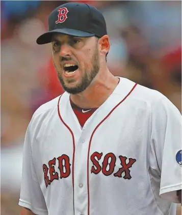  ?? STAFF PHOTO BY NANCY LANE ?? DOWN AND OUT: John Lackey reacts as he leaves the game in the eighth inning of the Red Sox' loss to the Tigers yesterday at Fenway Park.