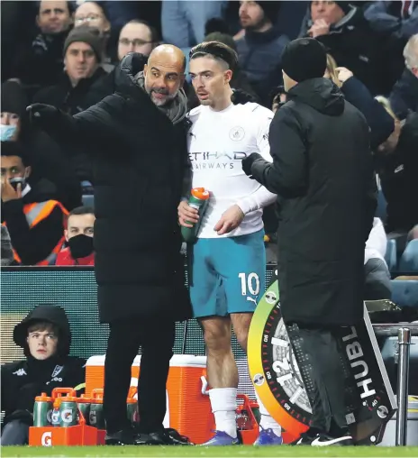  ?? Getty ?? Manchester City manager Pep Guardiola, left, brought Jack Grealish off the substitute’s bench in the last few minutes of the game against his former club Aston Villa on Wednesday, despite the England midfielder not yet being fully fit