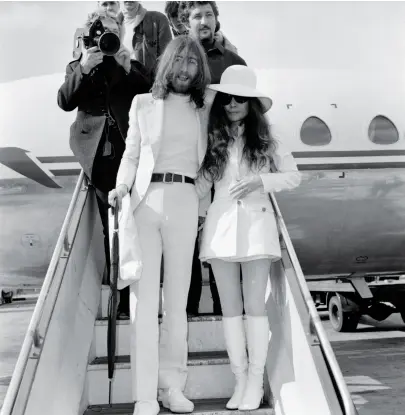  ??  ?? BALLAD OF JOHN AND YOKO Lennon and Ono leaving Gibraltar after getting married. John adopted Yoko’s name, becoming John Ono Lennon — a radical step in 1969.