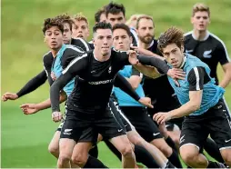  ?? PHOTOSPORT ?? Abdulla Al-Kalisy, right, tussles with Storm Roux during an All Whites training session earlier this year.