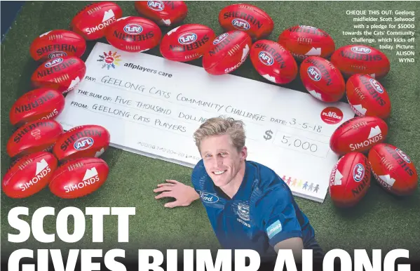  ??  ?? CHEQUE THIS OUT: Geelong midfielder Scott Selwood with a pledge for $5000 towards the Cats’ Community Challenge, which kicks off today. Picture: ALISON WYND FROM BACK PAGE