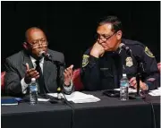  ?? Karen Warren / Houston Chronicle ?? Mayor Sylvestor Turner and Houston Police Chief Art Acevedo listen to residents’ concerns. “We want our neighborho­od back,” one mother lamented.