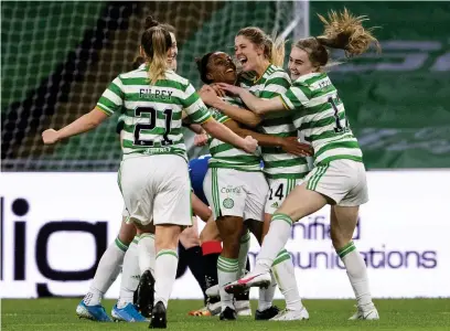  ??  ?? Celtic’s Mariah Lee, centre, celebrates with her team-mates after scoring against Rangers