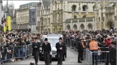  ?? JOE GIDDENS/PA VIA AP ?? The hearse containing Professor Stephen Hawking arrives at University Church of St. Mary the Great as mourners gather to pay their respects, in Cambridge, England, on Saturday. The renowned British physicist died peacefully on March 14 at the age of 76.