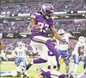  ?? Andy Clayton-King / Associated Press ?? Minnesota Vikings running back Dalvin Cook scores on a 3yard touchdown run during the first half against the Detroit Lions in December.