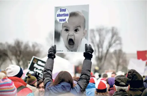  ?? ?? ANTI-ABORTION DEMONSTRAT­ORS march to the US Supreme Court in Washington on January 23, 2012, to mark the 39th anniversar­y of the court’s landmark Roe vs Wade decision that had legalised abortion. The court, which turned decisively conservati­ve during the Trump presidency, overturned that judgment this year.