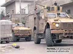  ??  ?? PATROL US armoured vehicles at attack site