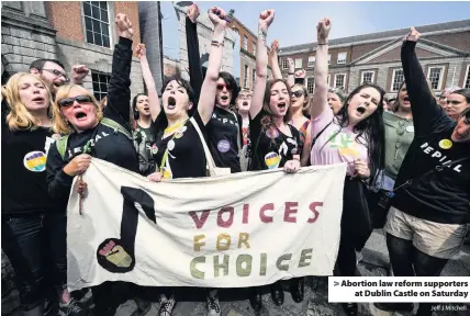  ?? Jeff J Mitchell ?? > Abortion law reform supporters at Dublin Castle on Saturday