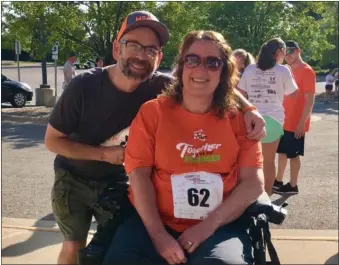  ?? COURTESY PHOTO ?? Come September, Dan and Jennifer Digmann will celebrate their 16th wedding anniversar­y. Jennifer, 46, who gets about in a wheelchair, has the secondary progressiv­e form of MS. Dan, 48, has the relapsing-remitting form and is able to walk.