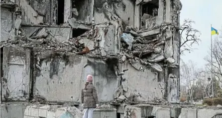  ?? Picture: REUTERS/ GLEB GARANICH ?? SIGN OF THE TIMES: A work of world-renowned graffiti artist Banksy is seen at the wall of a destroyed building in the Ukrainian town of Borodianka, which had been occupied by Russia until April and heavily damaged by fighting in the early days of Russian invasion.