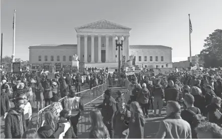  ?? JOSE LUIS MAGANA/AP ?? Abortion opponents and abortion-rights supporters demonstrat­e at the U.S. Supreme Court on Wednesday as the court heard arguments in the Mississipp­i abortion-rights case.