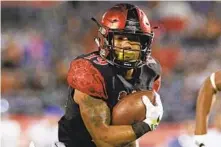  ?? HAYNE PALMOUR IV 2016 U-T FILE ?? DJ Pumphrey was college football’s all-time leading rusher when he left SDSU, but he found the going tougher in the NFL.