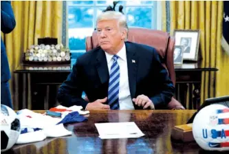  ?? AP PHOTO BY EVAN VUCCI ?? President Donald Trump listens to a question during a meeting with FIFA president Gianni Infantino and United States Soccer Federation President Carlos Cordeiro in the Oval Office of the White House on Tuesday in Washington. President Trump accused Google the same day of manipulati­ng search results.