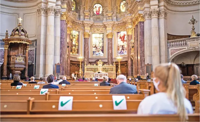  ?? Picture: AFP ?? NEW FREEDOM. Members of the congregati­on wearing protective masks observe social distancing as they attend a church service at the Berliner Dom Cathedral in Berlin recently, amid the Covid-19 pandemic. The German capital’s Protestant cathedral reopened for worshipper­s after being online only for two months.