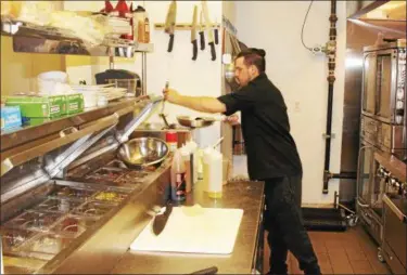  ?? TAWANA ROBERTS — THE NEWS-HERALD ?? Casa Di Vino Winery and Restaurant Executive Chef Christophe­r Fortney prepares the popular Fisherman’s Pasta.